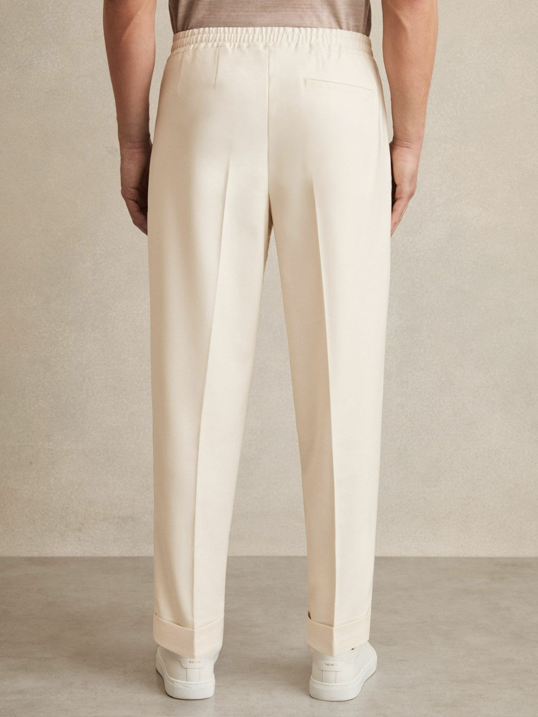 Relaxed-Fit Pleated Tapered Trousers Ecru | Men