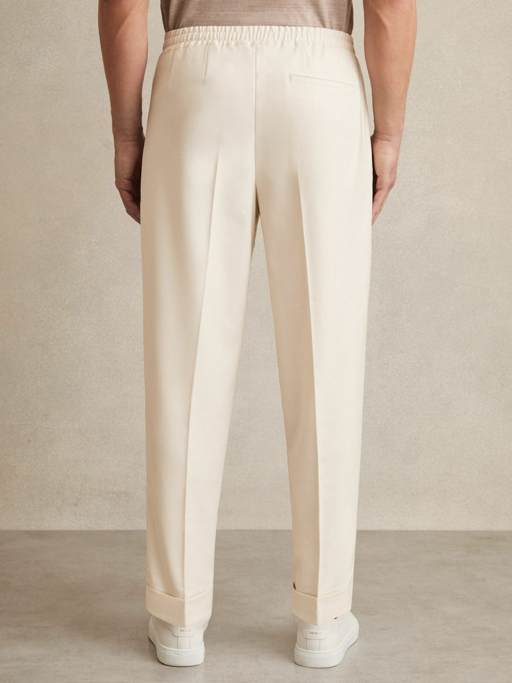 Relaxed-Fit Pleated Tapered Trousers Ecru | Men